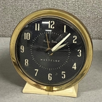 Vintage Mechanical Clock on Wooden Desk